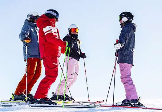 ESF Ski School standing and chatting
