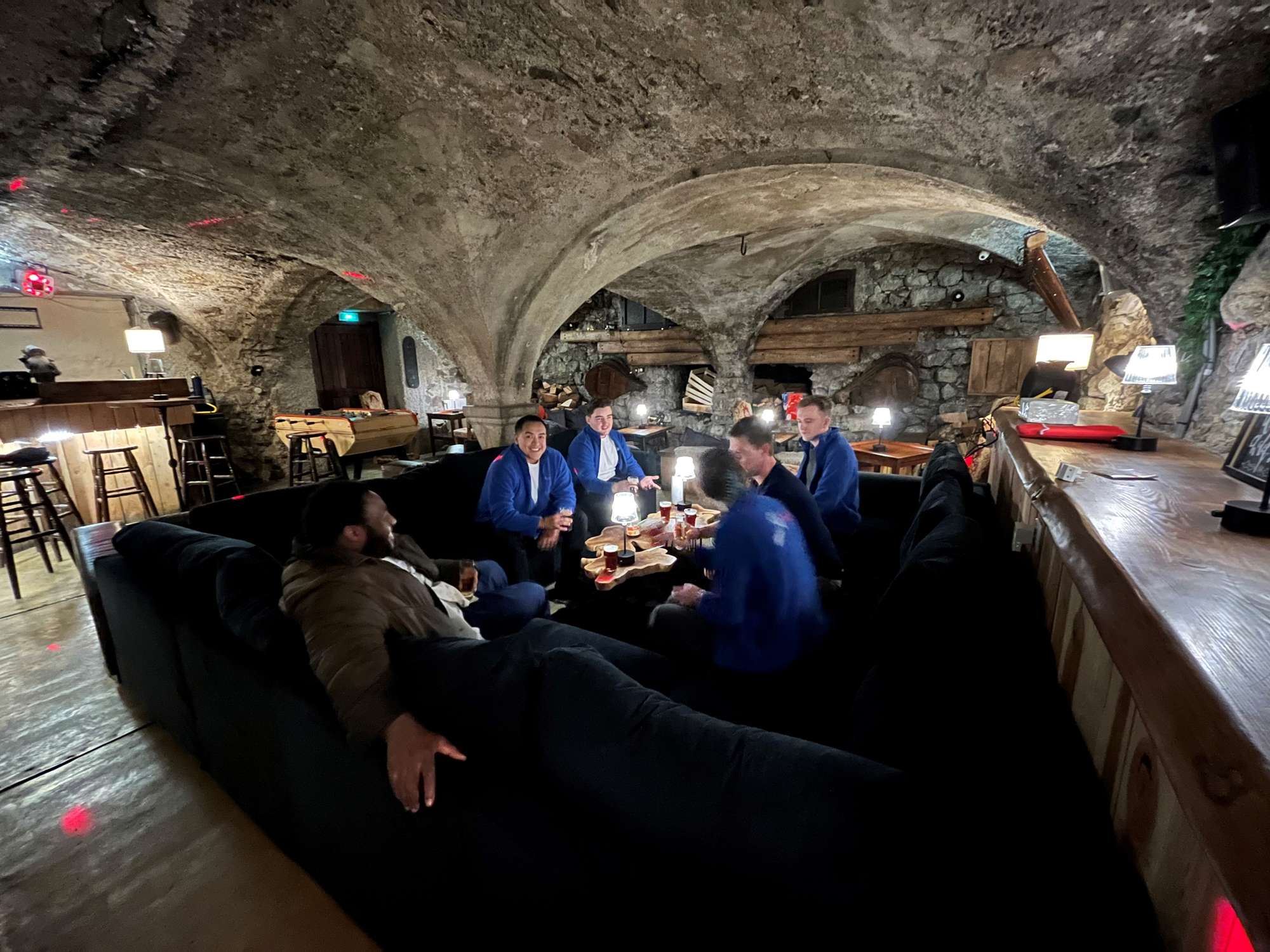 Taken 12 Dec 2023 in Montgenèvre by Max Ski Miquel team drinking on the sofa Elise bar wide shot